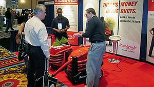 An ACCA contractor stops by the Rotobrush booth at the Indoor Air Expo.
