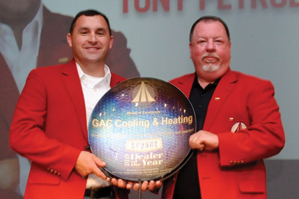 Tony Petrolle (left) and Randy Hamilton (right) of GAC Cooling & Heating accepted the Bryant Dealer of the Year award at the 2013 Bryant Dealer Rally.