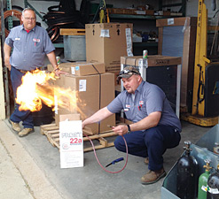 This photo was supplied to The NEWS by contractors from the Lafayette, Ind., area, who were concerned over the sale of a 95 percent propane/butane product promoted for retrofitting into R-22 systems, the demonstrators show the flammability potential.