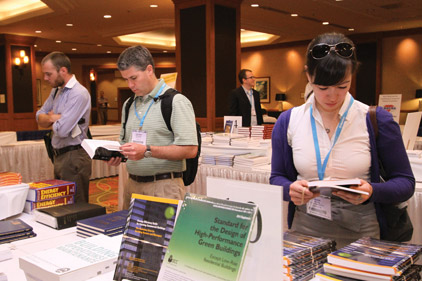 Customers thumb through the selection of offerings available at the ASHRAE Bookstore during ASHRAEâs annual conference in Denver.
