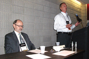 A presentation on ammonia refrigeration systems pressure relief venting is given by William Greulich of Kensington Consulting. Seated is Brian Marriott, who moderated the Q&A portion of the presentation.