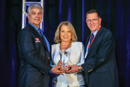 Anderson (center) was recognized for excellence in the HVACR industry, including professionalism, innovative practices, and community service, among other things.