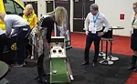 An ACCA attendee showcased her golf game at the One Hour booth. - The ACHR News