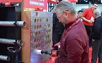 Visitors to Milwaukee’s booth could try out a variety of tools, including the Dozer hole saw. - The ACHR News
