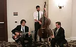 Trio bringing some holiday music to one company's festivities.