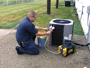 service technician recovering refrigerant