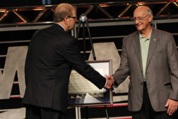 MCAA 2012 president Mac Lynch (left) presents the Distinguished Service award to MCAA past president Robert J. Durr Sr. (right).