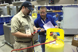 A contestant in the refrigerant recovery aspect of the HVACR competition at SkillsUSA