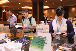 Customers thumb through the selection of offerings available at the ASHRAE Bookstore during ASHRAEâ€™s annual conference in Denver.