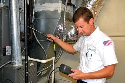 When replacing or servicing HVAC equipment, technicians have an opportunity to approach the customer about additional duct services, such as leakage testing. (Photo by Atchley Air, Fort Smith, Ark.)