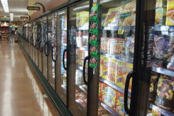 The absence of open display cases are becoming more and more common in supermarkets as stores are converted to closed cases.