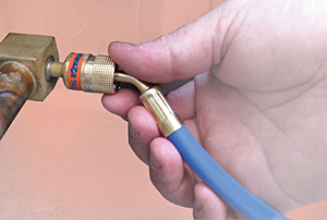 Anti-Blowback Fitting Allows Service Hose to Be Connected Under Pressure