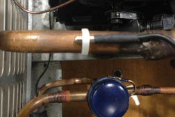 Figure 1: Looking down into a condensing unit, we see a non-insulated thermistor in the center.