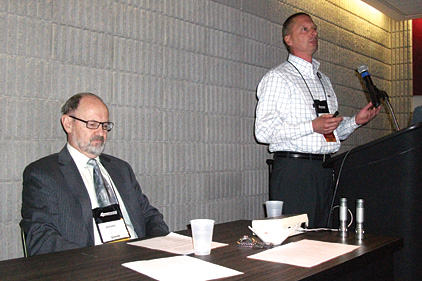 A presentation on ammonia refrigeration systemsâ?? pressure relief venting is given by William Greulich of Kensington Consulting. Seated is Brian Marriott, who moderated the Q&A portion of the presentation.