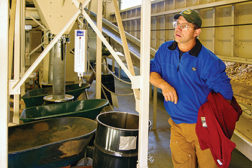 An Oregon Department of Forestry employee tours the boiler room at the Enterprise School District in Enterprise, Oregon. 