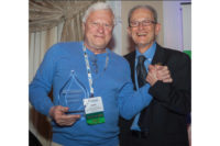 Aleks Roudnev, manager of research and design â?? applied hydraulics, Weir Minerals North America, accepts his 2014 Member of the Year Award 