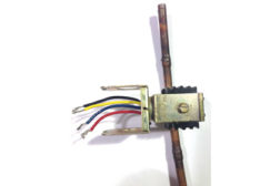 Figure 1. A solenoid valve with four different color wires coming from its wire housing.