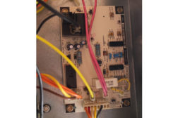 This is a photo of a typical heat pump circuit board. You can see the connections as well as the board components.
