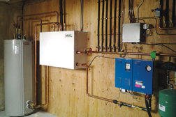 Figure 1: A direct expansion to water module (the white box) bridges the gap between air-source heat pumps and hydronics technology.