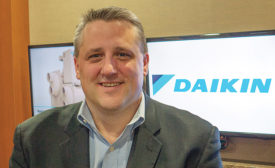STAY CONNECTED: Paul Rauker, vice president and general manager, Daikin Applied, said the Internet of Things is part of his daily workload.