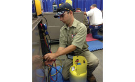 Contestant 511 competes in the refrigerant troubleshooting station where he is required to identify refrigerants and demonstrate proper recovery procedures.