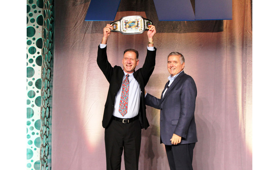 John Galyen, president, Danfoss North America (left), receives the 2015 Chairman's Challenge award from AHRI Chairman Ed Purvis.