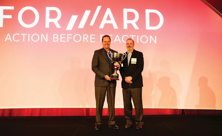 Johnstone Supply won the 2015 Big Man on Planet award from the Thermostat Recycling Corp. (TRC). CEO DeWight Wallace (left) accepts the trophy from TRCââ¬â¢s Mark Tibbetts.