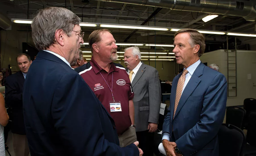 Gordy Noe (center), president of Pioneer Heating & Air Conditioning Inc., Knoxville, Tennessee, has explained to many people, including Tennessee governor Bill Haslam (right), the qualities of the Ride and Decide program.