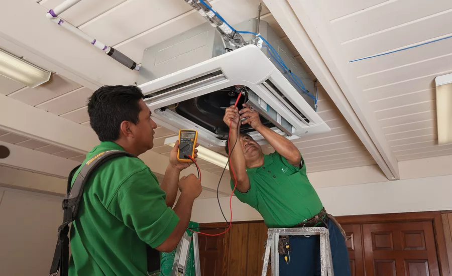 Ceiling cassettes, which were installed before drop ceilings were added, serve classroom spaces.