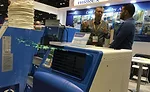 Luis Cheas (left), a sales manager for Airrex USA LLC, talks with an AHR Expo attendee about the company’s portable cooling and heating solutions.
