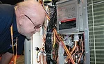 J.F. Townsend, Region 14 director, Refrigeration Service Engineer Society (RSES) in Downey, California, takes a close look at the inner workings of a new Daikin unit.