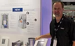 Mike Rimrodt, marketing director, Aprilaire, displays  the company’s Wi-Fi thermostat app, which has IAQ controls on a  mobile platform.