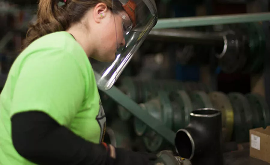 Christina Hadjer, a pipefitter at MMC, works in the mechanical contractor’s fabrication shop.
