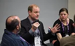 Kip Shanklin (center), owner of Shanklin Heating & Air Conditioning in Dalton, Ohio, participates in a discussion during a session at ACCA 2016.