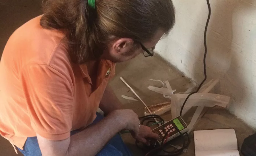 Walter Money, Whole House Energy Solutions LLC, takes efficiency readings as part of a home-performance installation. Photo courtesy of Nate Adams, Energy Smart Home Performance