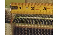 This photo shows a top view of a finned copper and aluminum coil. This photo shows a top view of a finned copper and aluminum coil.