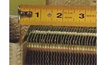 This photo shows a top view of a finned copper and aluminum coil.