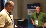 Brian Michael (right), director, residential sales development, unitary products group, national accounts, Johnson Controls Inc., talks about the York product line