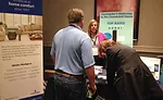 Joann Donelon, director of marketing, White-Rodgers, talks with contractors during the trade show portion of the International Roundtable meeting.