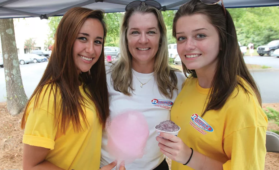 Company picnics – complete with snow cones and cotton candy – are a great way to get people away from the office environment and show your appreciation for their hard work. Photos courtesy of Reliable Heating & Air