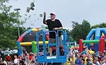 Dan Jape, CEO of Reliable Heating & Air, Woodstock, Georgia,“makes it rain” dollars at the company’s summer employee party.