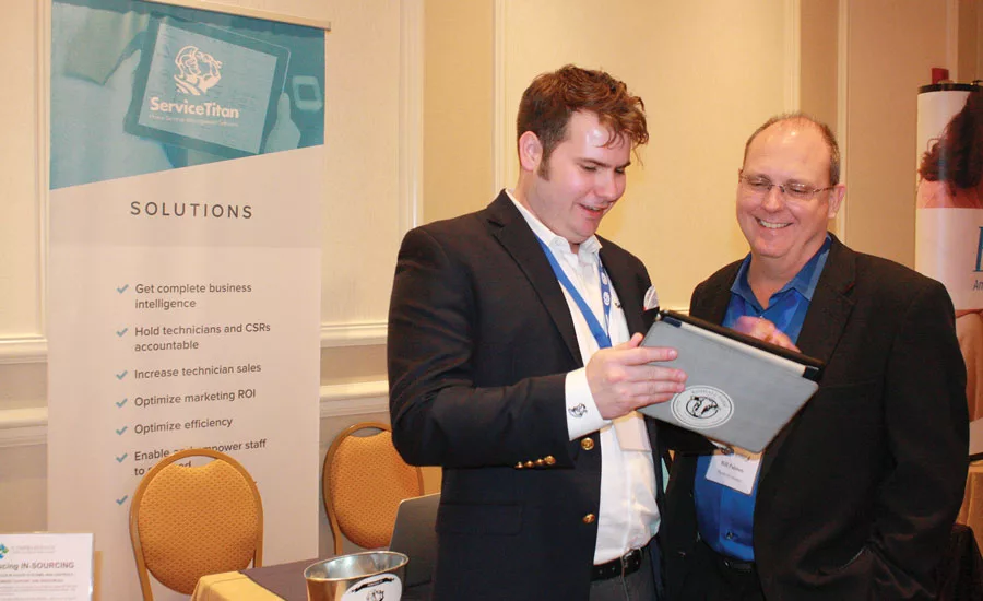 Patrick MacKenzie (left), sales team leader, ServiceTitan, discusses the organization’s powerful sales tools with Bill Palmer, president of The Profit Journey.