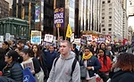 Demonstrators participate in a 2015 New York City rally and march to raise the minimum wage to $15.