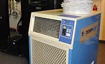 Heat-sensitive information technology (IT) equipment may require spot cooling to prevent the equipment from malfunctioning, especially during HVAC system maintenance or replacement