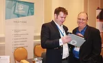 Patrick MacKenzie (left), sales team leader, ServiceTitan, discusses the organization’s powerful sales tools with Bill Palmer, president of The Profit Journey.