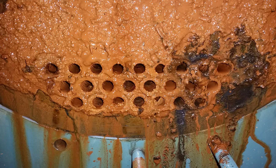condenser fouled with mud and sludge