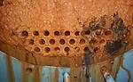 condenser fouled with mud and sludge