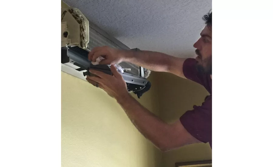 Remove the drain pan for cleaning while using a rag to keep water from dripping out - Ductless Systems - ACHR