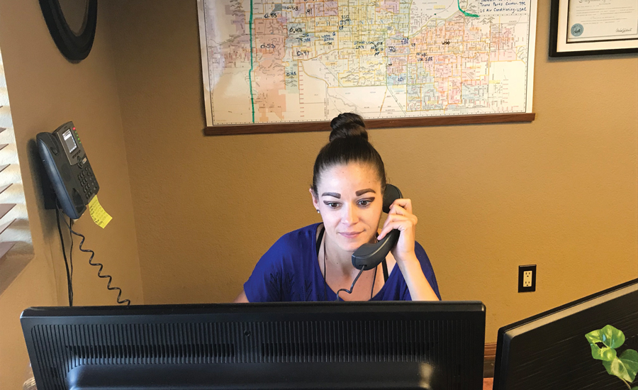 STAY THE COURSE: Rebecca Smith, customer service representative, Magic Touch Mechanical Inc., Mesa, Arizona, speaks with a client. The company prefers to stay consistent with its pricing year-round. - The NEWS - ACHR