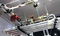 Uponor’s booth featured an aerial display of a radiant system using plastic piping. - The ACHR News